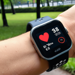 ** A runner using a running app on their smartwatch, with data displayed showing pace, heart rate, and distance. The background subtly shows a city park. Focus on the technology and healthy lifestyle aspect.

**