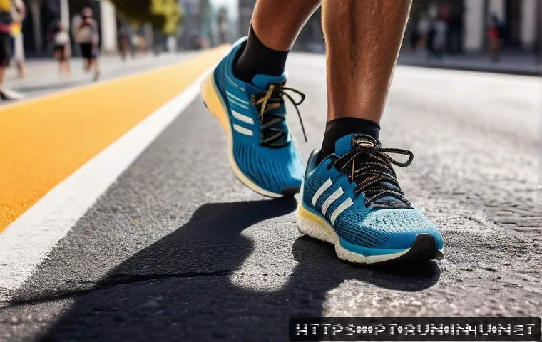 러닝화 쿠션 소재별 특징 - A close-up dynamic scene of a runner’s feet striking an urban asphalt road wearing modern running sh...